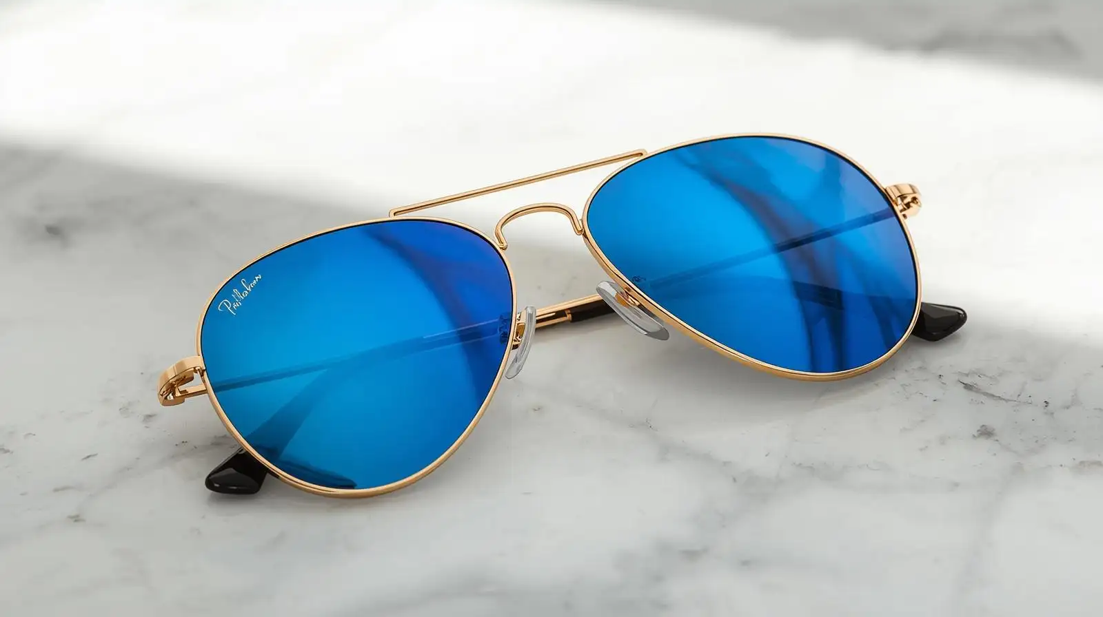 Stylish person wearing aviator mirrored sunglasses urban street style